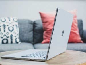 Microsoft laptop on a wooden stool