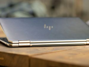 hp spectre laptop on a wooden desk