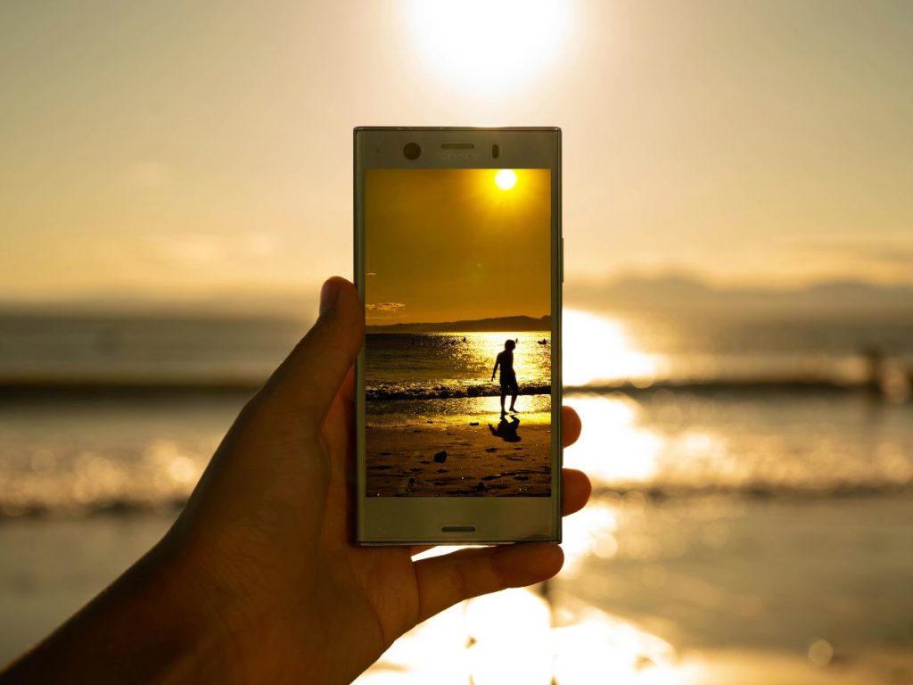 sony smartphone with camera open on beach